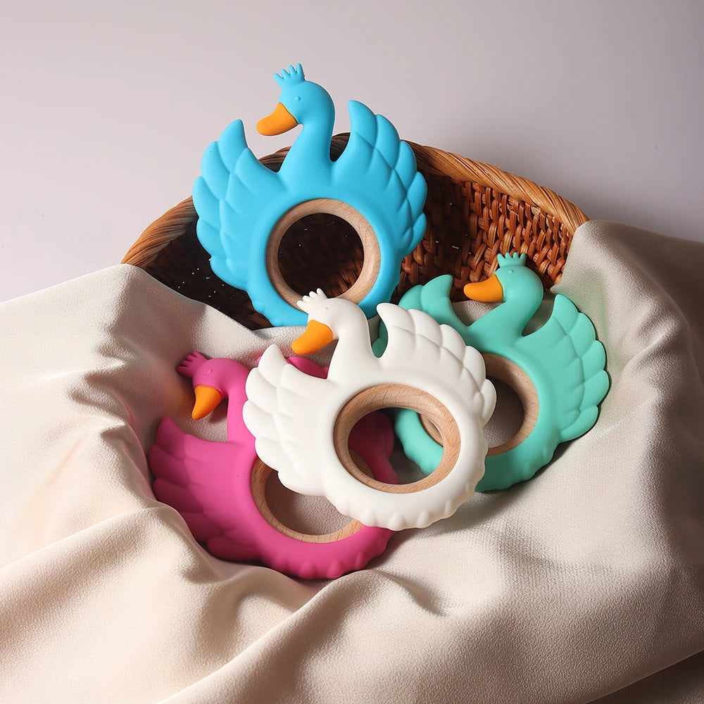 Anneau de dentition bébé en silicone & bois – Cygne bleu lagon